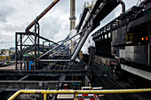 Huge, heavy steel production plant and industry terrain, producing various kinds of steel inside an CO2 Emitting and Exhausting Factory. IJmuiden, Netherlands.