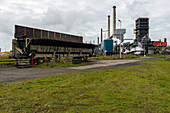 Huge, heavy steel production plant and industry terrain, producing various kinds of steel inside an CO2 Emitting and Exhausting Factory. IJmuiden, Netherlands.