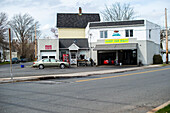 Harrison, New York, USA. Small and cosy car wash with square in front.