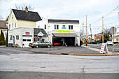 Harrison, New York, USA. Small and cosy car wash with square in front.