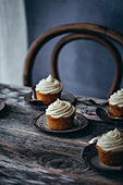 Carrot cupcakes on a wooden table