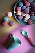 Colourful French macarons. Retro colour blocking aesthetic flat lay.