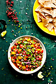 Pico de gallo made with heirloom tomatoes, served with French fries