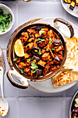 Aubergine bhaji, traditional Indian cuisine, served with garnish