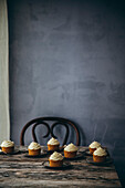 Carrot cupcakes on a wooden table