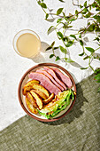 Corned Beef, Roasted Potatoes and Cabbage Meal on a green and white background