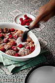 caramel croissant pudding with fresh raspberries