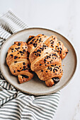 Chocolate Croissants on plate and white background