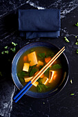 Rustic miso soup in the Okinawa style, close-up.