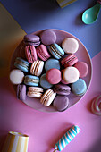 Colourful French macarons. Retro colour blocking aesthetic flat lay.