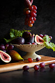 Bowl of figs and red grapes.