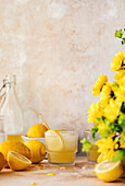 Fresh homemade lemonade, with lemons and flowers. With copy space.