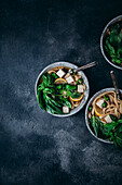 Pho noodle soup against a blue background