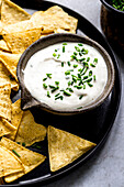 nachos served with sour cream chives dip