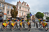 Bike self-service station in front of the Church of St. Casimir, Vilnius, Lithuania, Europe