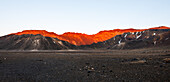 Walls of Tongariro Volcano lit by red sunrise, volcanic plains of New Zealand, Tongariro National Park, UNESCO World Heritage Site, North Island, New Zealand, Pacific