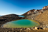 Close up of turquoise, vibrant Emerald Lake with steaming volcano on Tongariro Crossing, Tongariro National Park, UNESCO World Heritage Site, North Island, New Zealand, Pacific