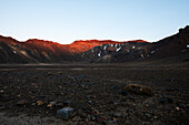 Red sunrise on the ridge of Tongariro Volcano and arid ash fields in the foreground, Tongariro National Park, UNESCO World Heritage Site, North Island, New Zealand, Pacific