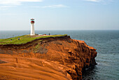 Lighthouse on the sandstone cliffs of Etang-du-Nord cape, Cap aux Meules island, Magdalen Islands, Gulf of Saint Lawrence, Quebec province, Canada, North America