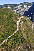 Road overhanging the deep gorge of the Vorotan River viewed from the cable car connecting the village of Halidzor, Syunik Province in southeastern Armenia, Eurasia