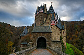 Eltz medieval historic castle in an autumn landscape with trees at sunrise, Wierschem, Rhineland-Palatinate, Germany, Europe