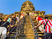 Tourists at Angkor Wat, UNESCO World Heritage Site, a Hindu-Buddhist temple complex near Siem Reap, Cambodia, Indochina, Southeast Asia, Asia