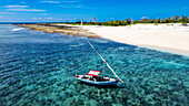 Aerial of a traditional Dhow on a white sand beach, Goa island near the Island of Mozambique, Mozambique, Africa