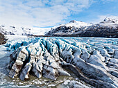 Aerial drone view of particular ice textures formed in the Svinafellsjokull glacier following global warming, Iceland, Polar Regions