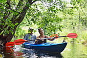 Canoe trip on a branch of the river connecting the lakes Almajas and Asekas around Ginuciai, Aukstaitija National Park, Lithuania, Europe