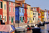 Colourfully painted houses along a canal in Burano island, Venice, UNESCO World Heritage Site, Veneto region, Italy, Europe