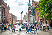 People on the streets of Old Town in Torun, Poland, Europe