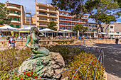 View of Sirena the Mermaid and cafes on Carrer d'En Bordils, Porto Cristo, Majorca, Balearic Islands, Spain, Mediterranean, Europe