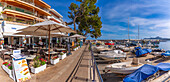 View of restaurants in the harbour at Cala Rajada, Majorca, Balearic Islands, Spain, Mediterranean, Europe