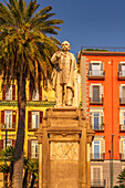 View of Nicola Amore statue and colourful architecture in Piazza della Vittoria, Naples, Campania, Italy, Europe