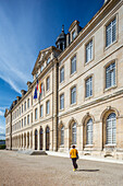 Elegant city hall building in Caen, Normandy, France, showcasing historic architecture on a sunny day with a clear blue sky.