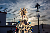 A creative Christmas tree constructed from plastic bottles promoting recycling in Alfonso XIII village, Isla Mayor, Sevilla, Spain.