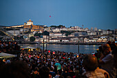 Hot air balloons launching over Luis I bridge and Douro River during Festival of St John of Porto (Festa de São João do Porto ) during Midsummer, on the night of 23 June (Saint John's Eve), in the city of Porto, Portugal