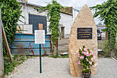 A memorial stone at the World War II German submarine base in Lorient, Brittany, France, honoring fallen workers.