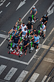 Group of tourists riding scooters, view from above, Prague