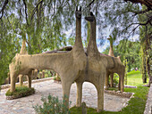 A pavilion in the shape of llamas or guanacos on the grounds of the Hosteria Automovil Club Argentino in Cachi, Argentina.