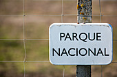 Close-up of a Parque Nacional sign in Doñana, España, indicating a protected national park in the region.