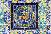 The Saint Mark emblem depicted in colorful glazed ceramic tiles at the Fine Arts Museum in Seville, Spain.