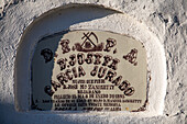 Old gravestone from the 19th century in the Catholic cemetery of Aznalcazar, located in Sevilla Province, Andalucia, Spain.