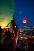 Hot air balloons launching over Luis I bridge and Douro River during Festival of St John of Porto (Festa de São João do Porto ) during Midsummer, on the night of 23 June (Saint John's Eve), in the city of Porto, Portugal