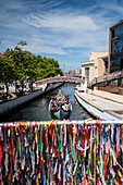 Boat ride through canals in a colorful and traditional Moliceiro boat, Aveiro, Portugal