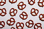 Overhead view of pretzels on white background