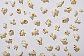 Overhead view of popcorn on white background