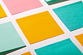 Close-up of colorful blank adhesive notes on white background