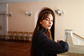 Portrait of woman standing in hallway