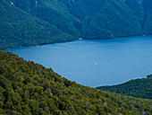 Blue lake surrounded with green hills